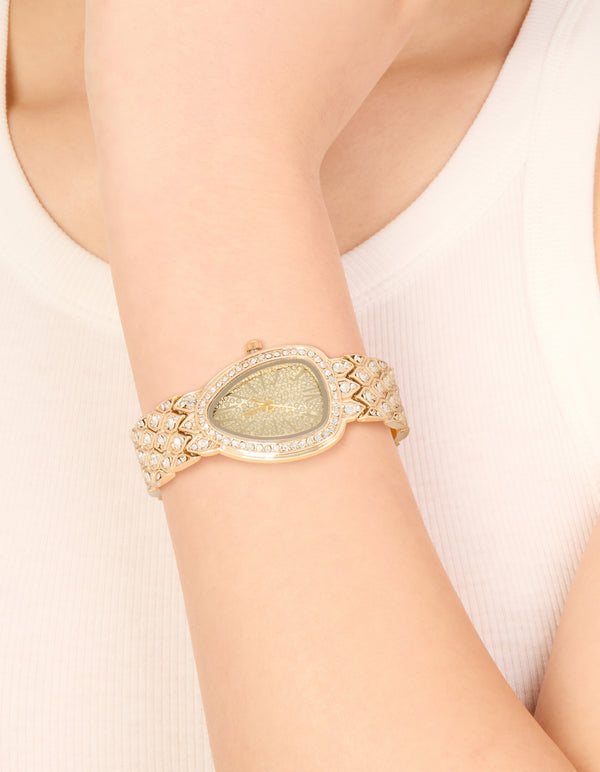 Showcasing this gold diamante statement watch features stone dial look, analog display, link band in casual styling for women on wrist view