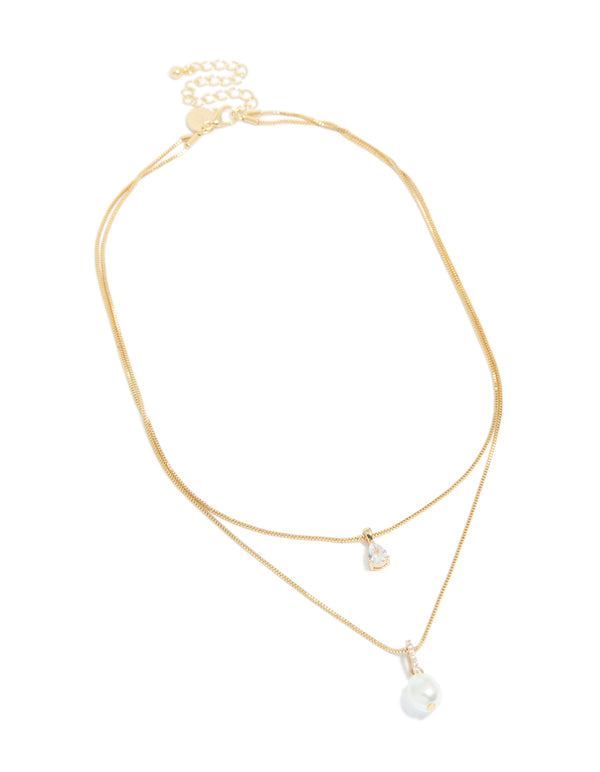 Featuring a gold plated cubic zirconia pearl layered necklace front view