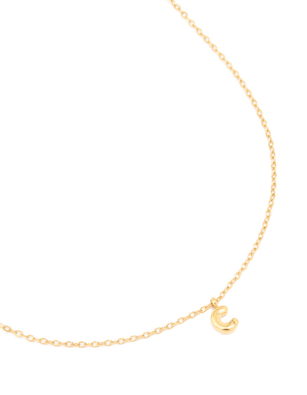 Crafted from waterproof gold plated stainless steel, this mini bubble letter initial pendant C necklace close up view