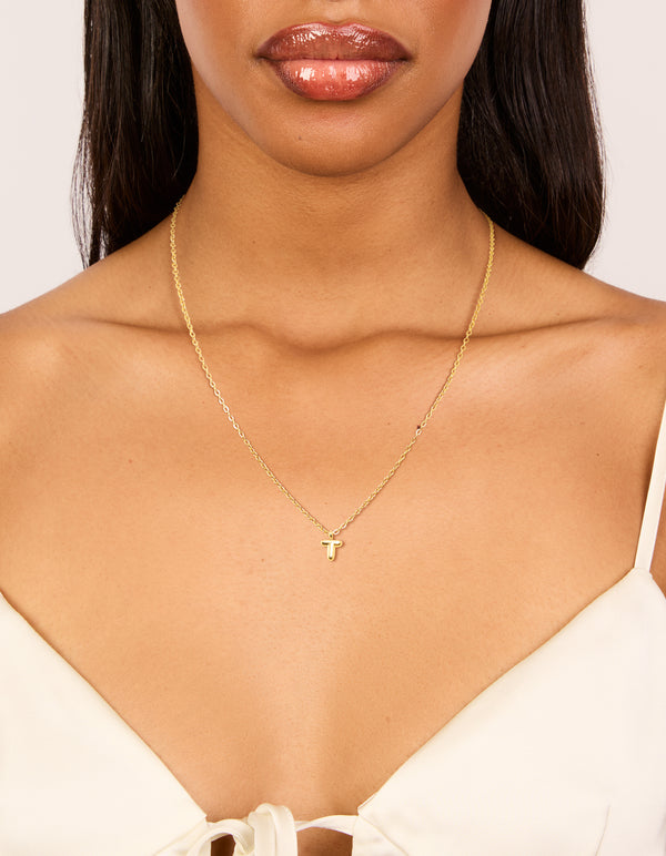 Stunning waterproof mini bubble initial T pendant necklace in gold plated stainless steel with dainty style on neck view
