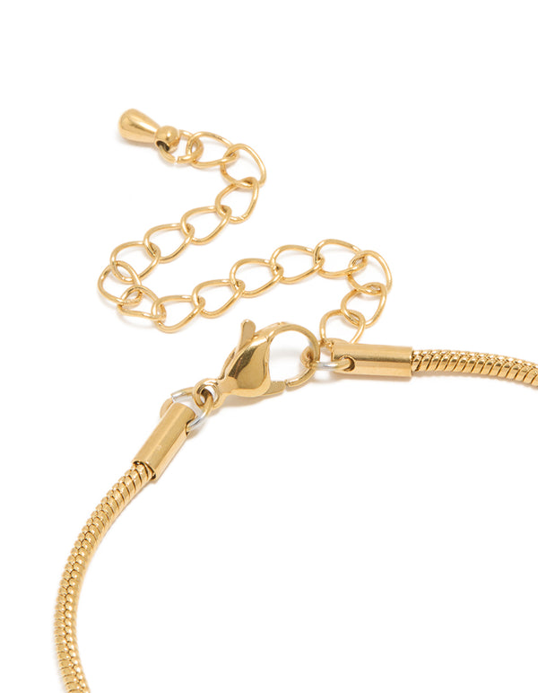 Crafted from waterproof gold plated stainless steel, snake chain bracelet with dainty detailing closure detail view