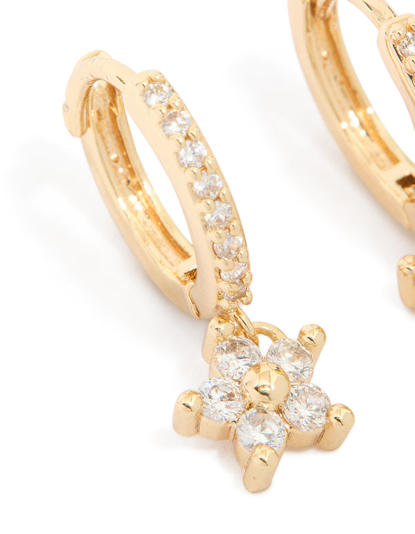 Crafted with gold plated cubic zirconia, these flower pendant huggie earrings showcase and huggie closure close up view