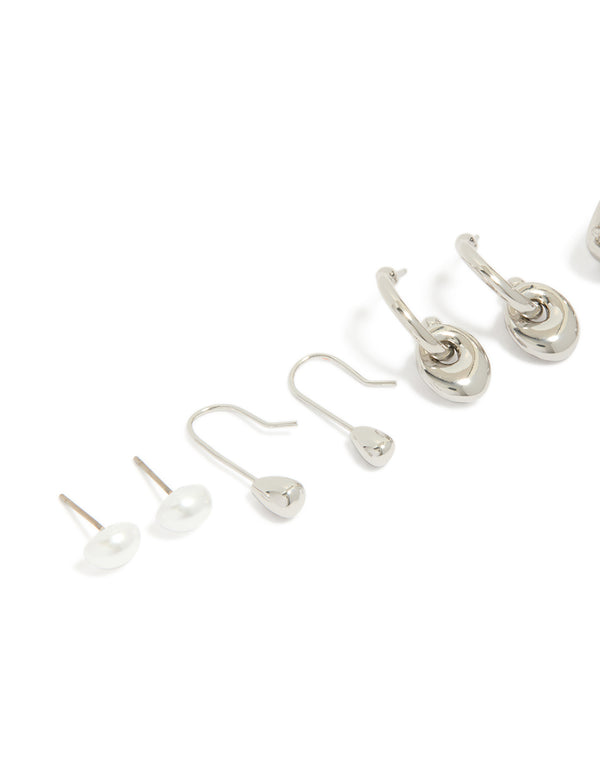Showcasing silver pearl and multi orb stud earrings 6-pack with dainty designs close up view