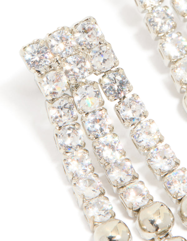 Showcasing silver cubic zirconia half cup chain drop earrings designed with clear stones close up view