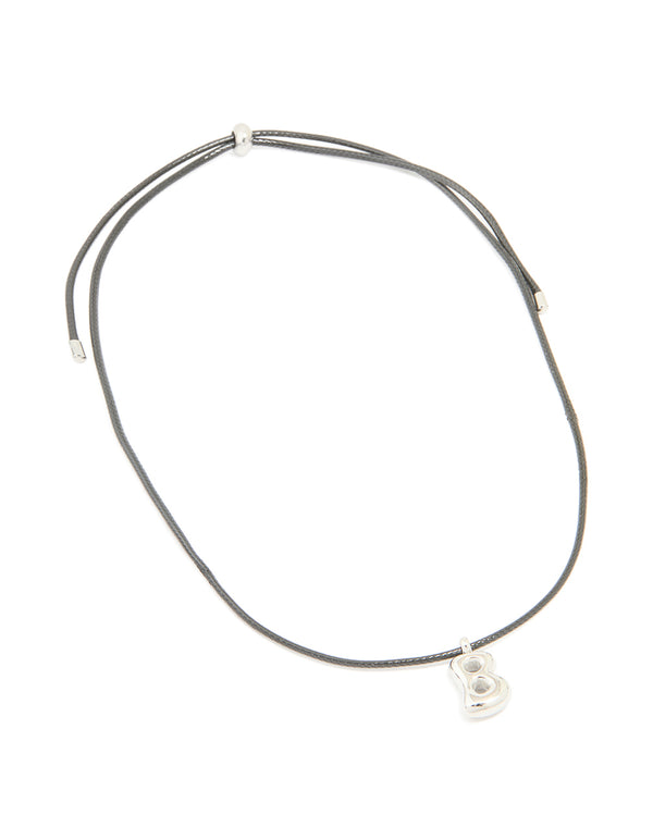 Featuring a waterproof stainless steel large bubble letter B cord necklace with initials pendant front view