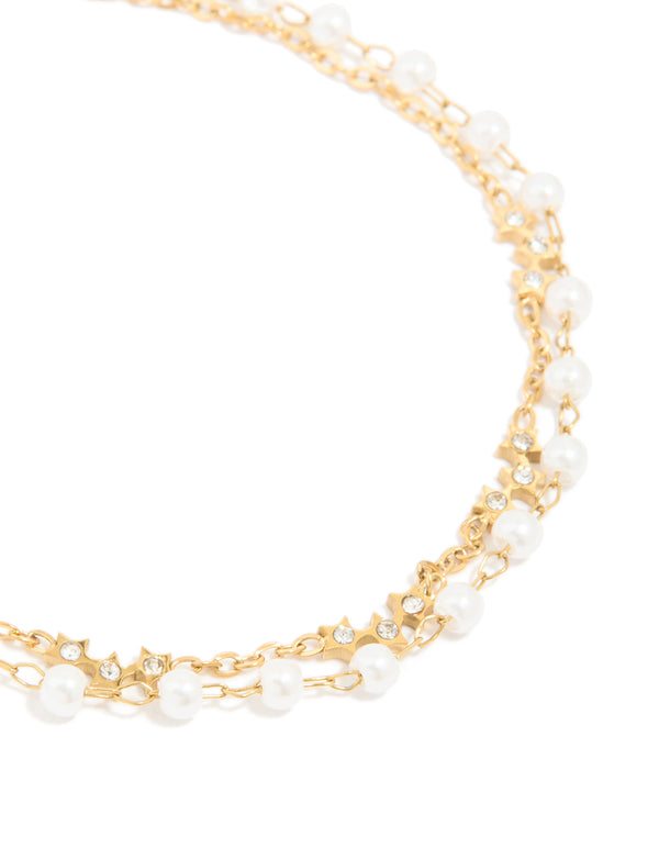 Crafted from waterproof gold plated stainless steel, pearl, and cubic zirconia bracelet close up view