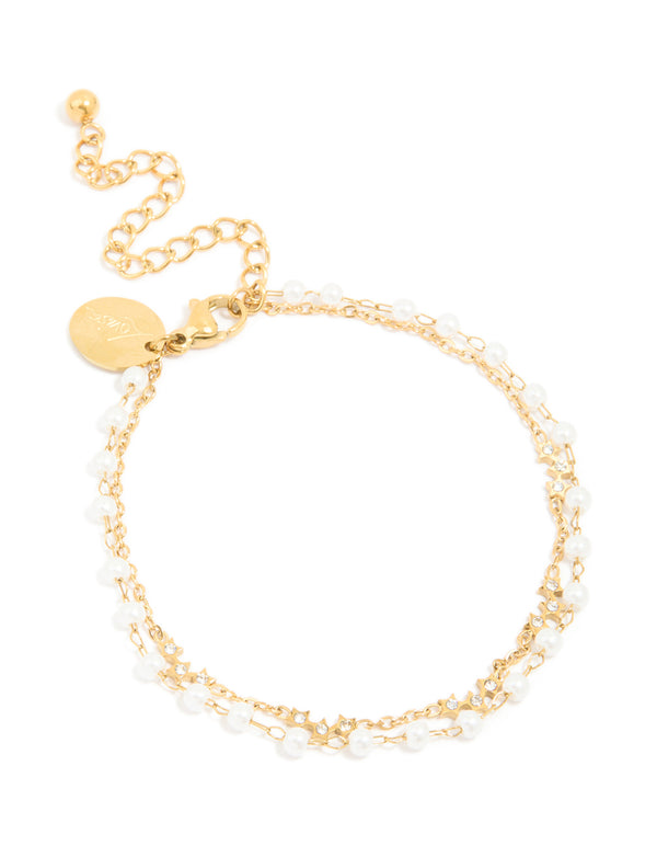 Showcasing a waterproof gold plated stainless steel bracelet, featuring pearl and cubic zirconia front view