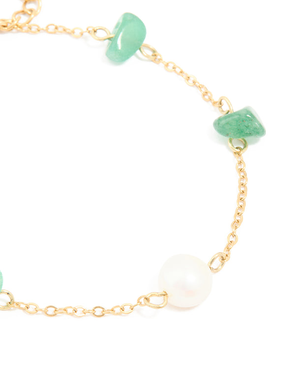 Crafted from waterproof gold-plated stainless steel, this bracelet features pearl beads and green semi precious stone chips in close up view