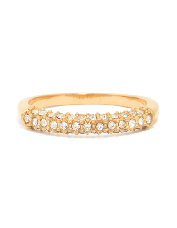 Showcasing a waterproof skinny ring crafted from stainless steel with pave set clear tone cubic zirconia in a gold plated finish close up view