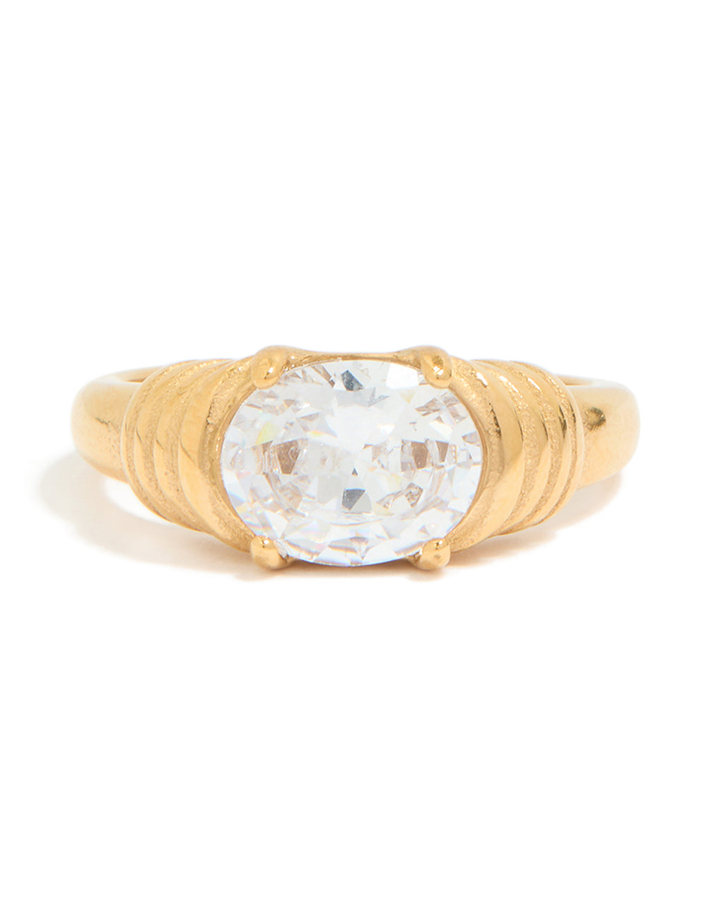 A waterproof gold plated stainless steel ring with oval cubic zirconia crystal and ribbed band close up view