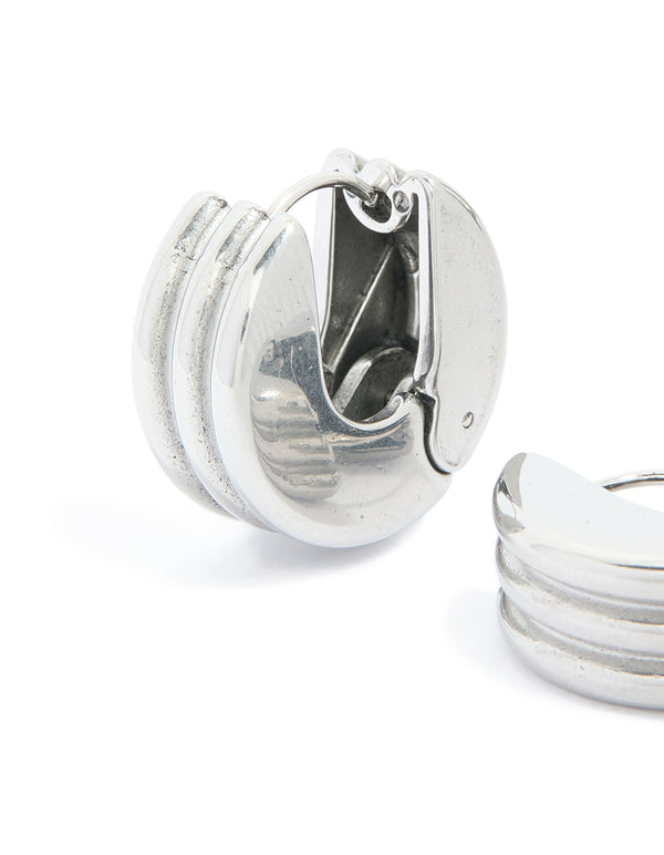 Crafted from waterproof stainless steel ribbed circle hinged hoop earrings in silver close up view