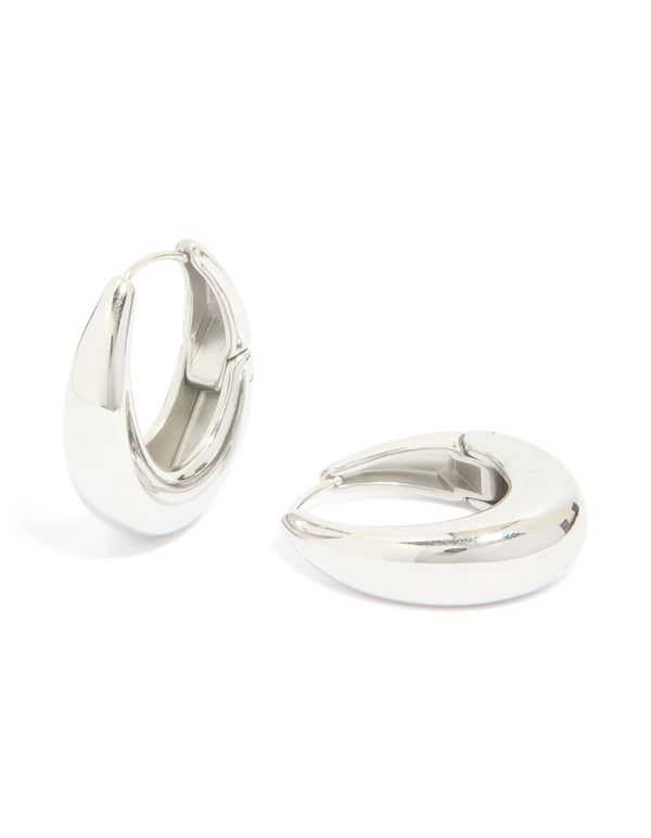 Featuring waterproof stainless steel oval hinged hoop earrings in silver front view