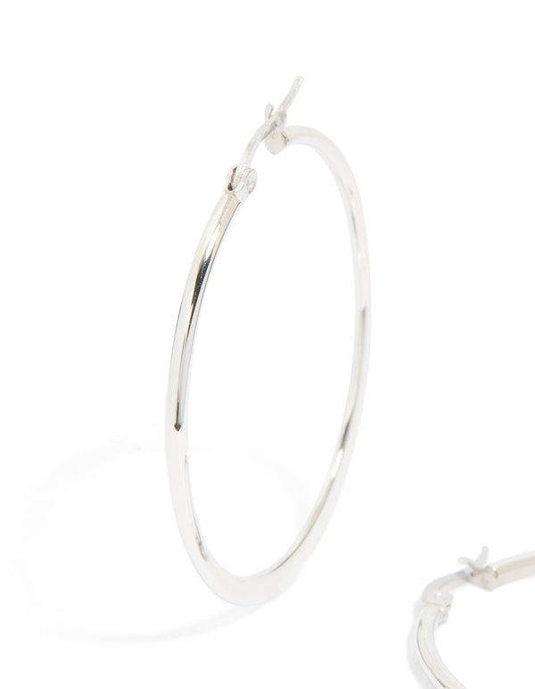 Crafted from waterproof stainless steel thin hoop earrings in a statement silver finish close up view