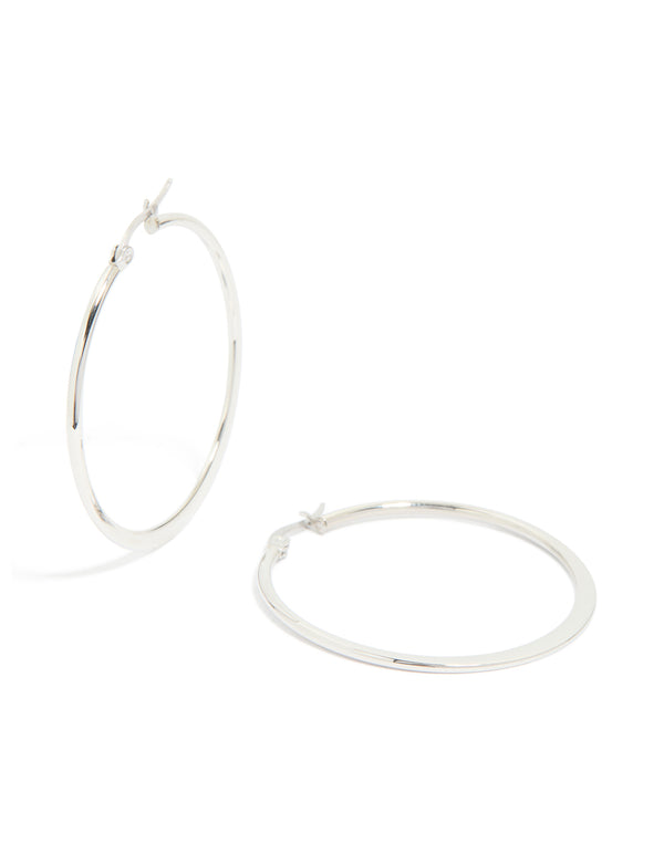 Showcasing waterproof stainless steel thin hoop earrings in a statement silver finish front view