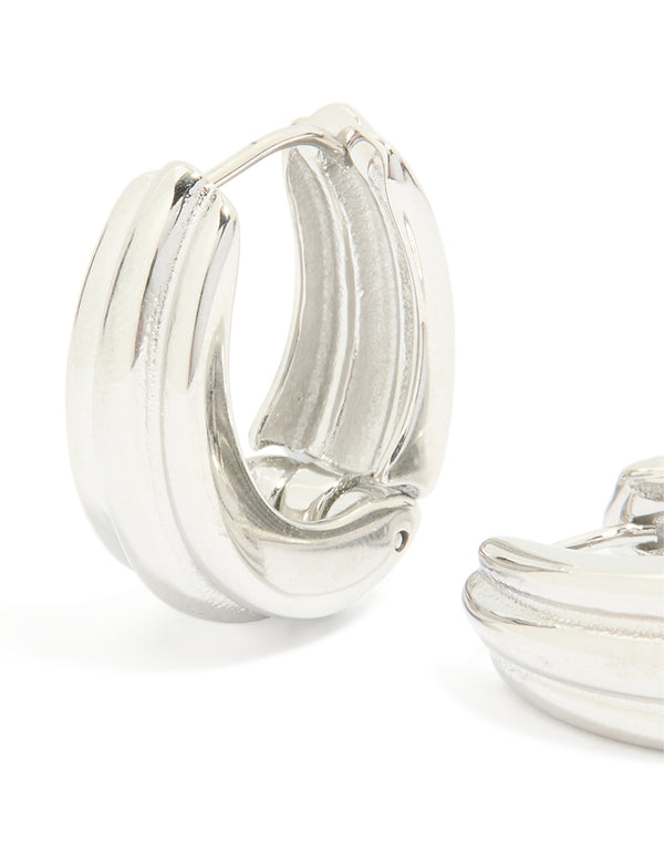 Highlighting waterproof stainless steel hinge hoop indented earrings in silver close up view