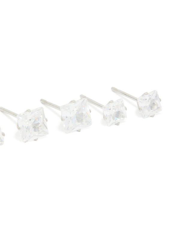 Highlighting waterproof stainless steel cubic zirconia square stud earrings in a 3-pack with silver and clear stones post detail view