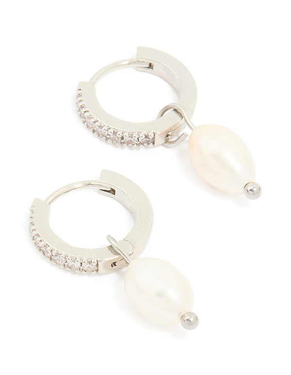 Showcasing drop huggie earrings with pearl and diamante crafted from waterproof stainless steel in silver front view