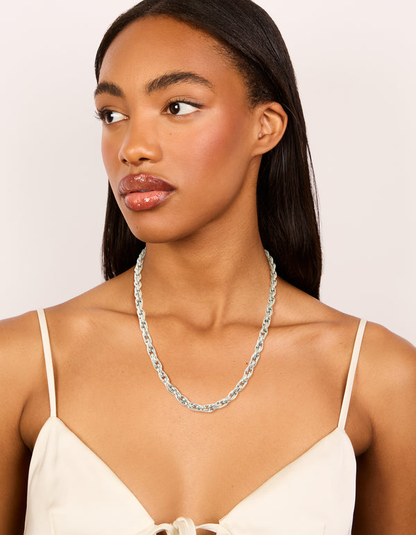 Featuring a waterproof stainless steel chunky chain necklace in silver on model view