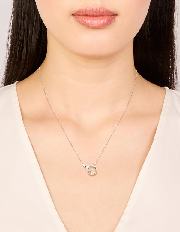 Featuring a waterproof stainless steel textured linked circles pendant necklace in silver with dainty styling on neck view
