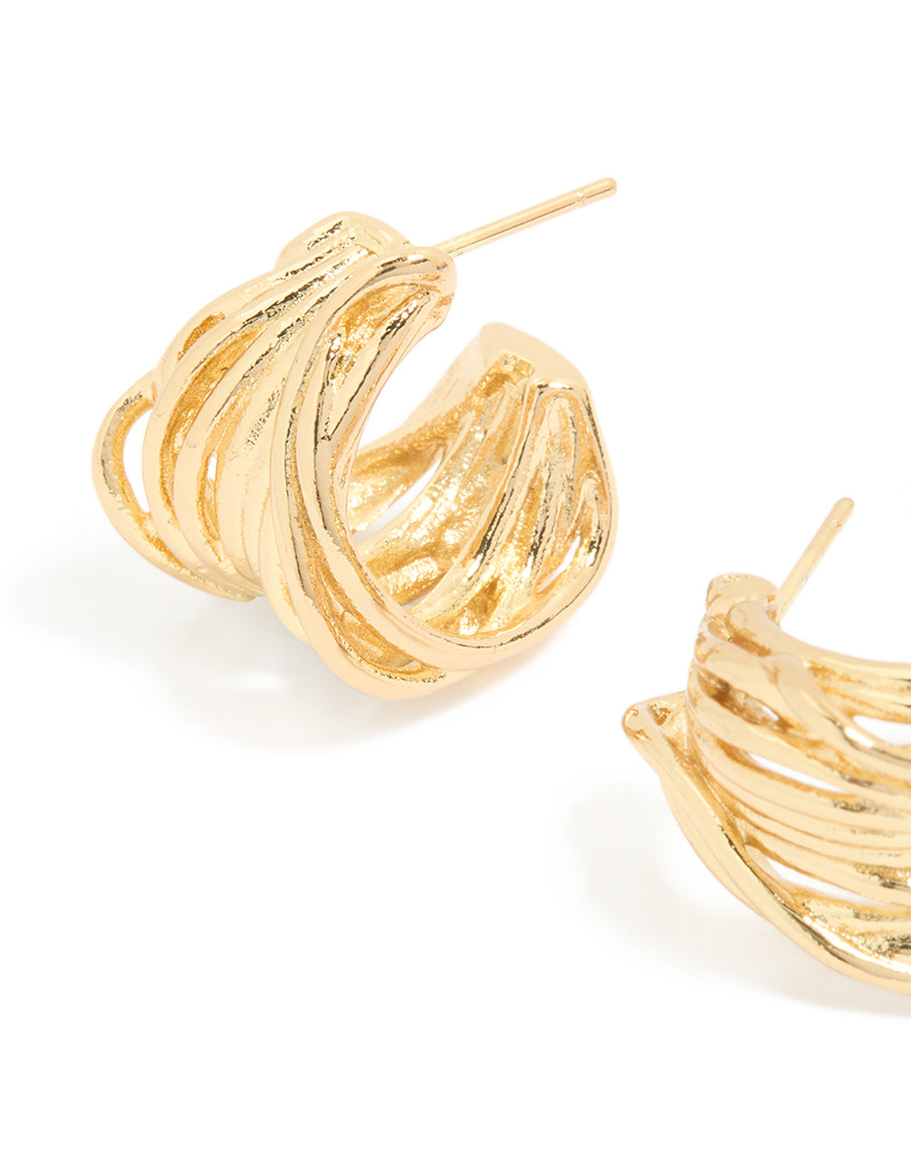 Highlighting waterproof gold plated stainless steel multi row huggie earrings with intricate layered bands and polished finish close up view