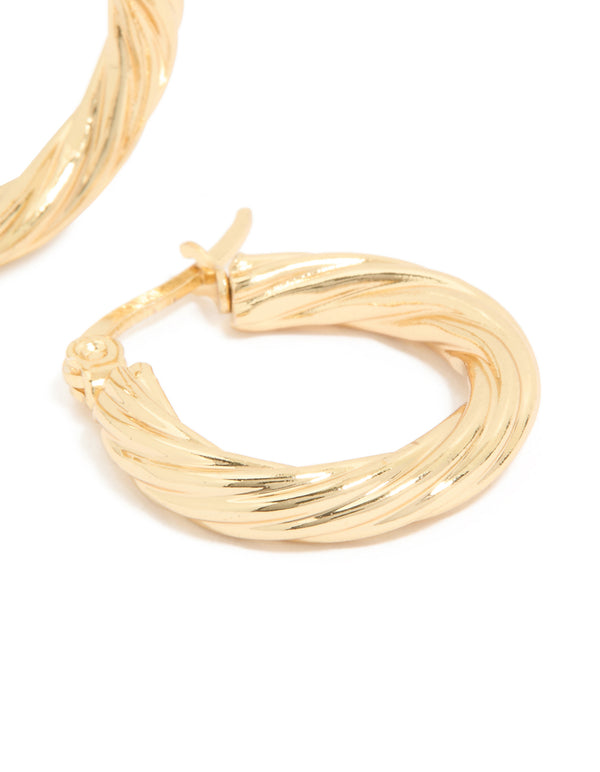 Highlighting waterproof small twisted hoop earrings in gold plated stainless steel with statement style close up view