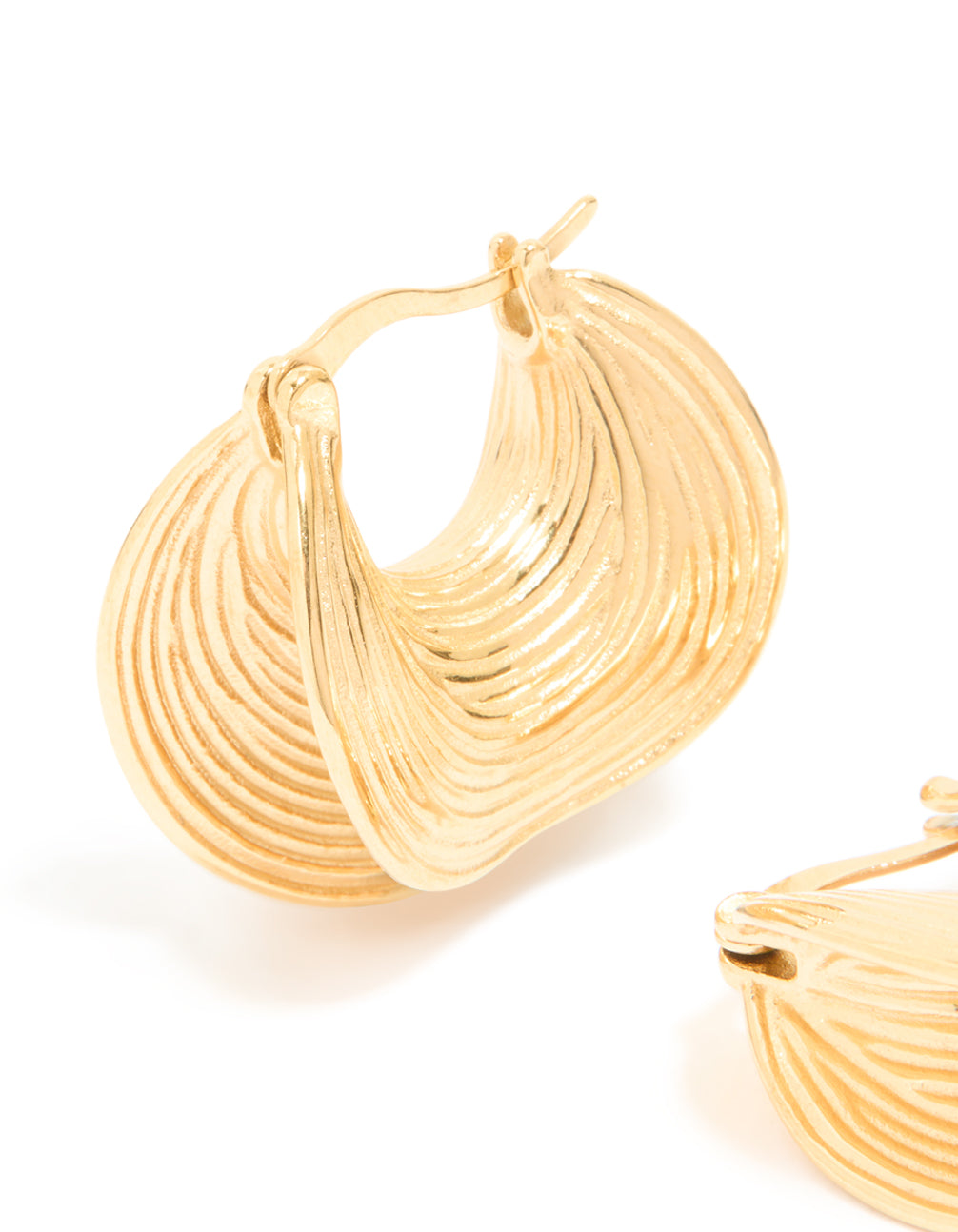 Displaying waterproof gold plated stainless steel etched chunky hoop earrings in gold close up view