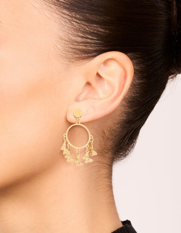 Showcasing waterproof gold plated stainless steel butterfly hoop earrings with charm details on ear view