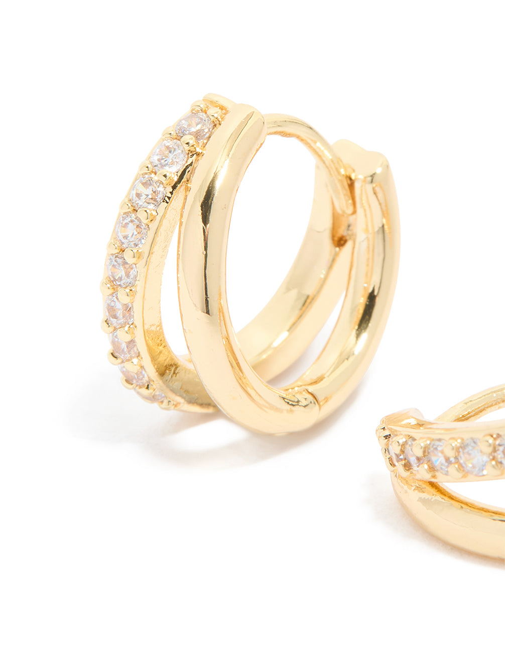 Featuring waterproof gold plated stainless steel cubic zirconia double row huggie earrings in gold close up view