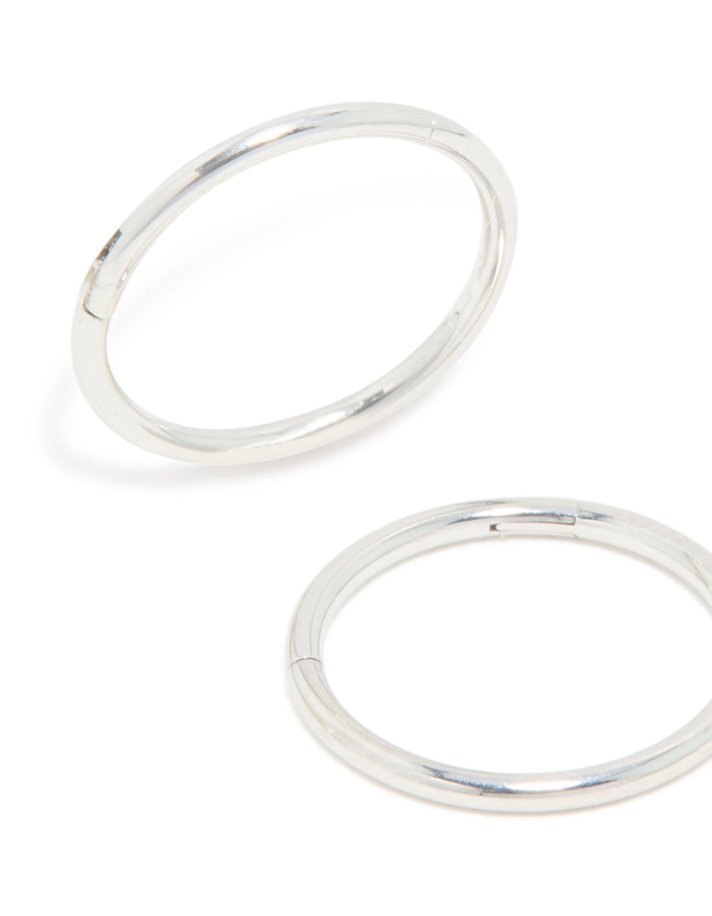 Crafted from surgical steel, these kids sleeper hoop earrings feature silver finish close up view