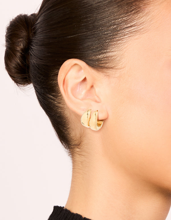 Showcasing waterproof gold plated stainless steel chunky and chubby hoop earrings in a 2-pack on ear view