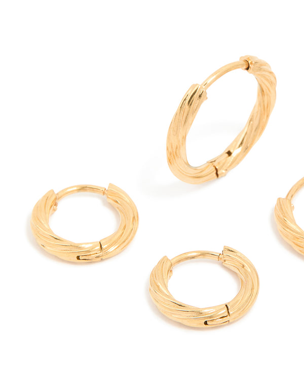 Highlighting small wrap huggie earrings made from waterproof gold plated stainless steel in a 3-pack close up view
