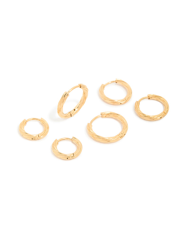 Showcasing small wrap huggie earrings in a waterproof gold plated stainless steel 3-pack front view