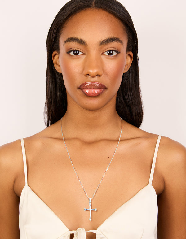 Elegantly crafted waterproof stainless steel large cross pendant necklace featuring in silver statement design on model view