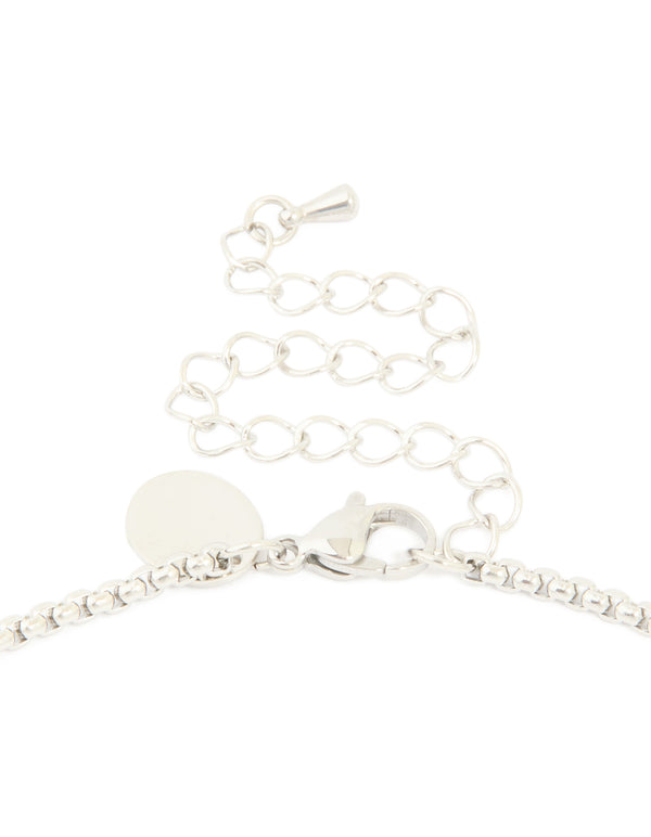 Presenting waterproof stainless steel pavé cubic zirconia cross necklace in silver clasp detail view