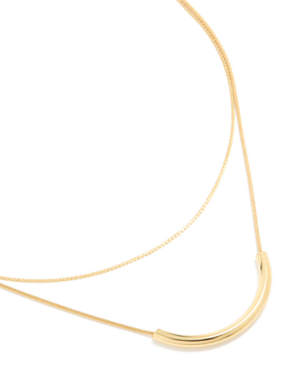 Introducing a waterproof curved bar and chain layered necklace crafted from gold plated stainless steel close up view