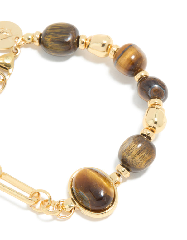 Designed with waterproof gold plated stainless steel beads, and tigers eye semi precious stone bracelet in brown close up view