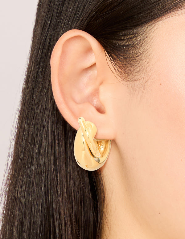Featuring waterproof gold plated stainless steel medium illusion hoop earrings with statement style on ear view
