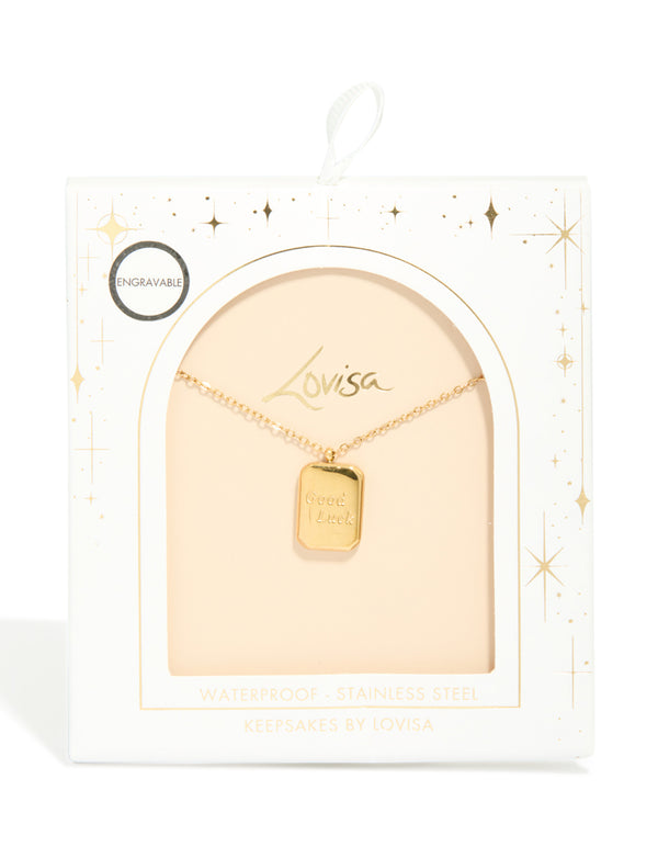 Highlighting a waterproof good luck pendant necklace in gold plated stainless steel featuring script with dainty design close up view