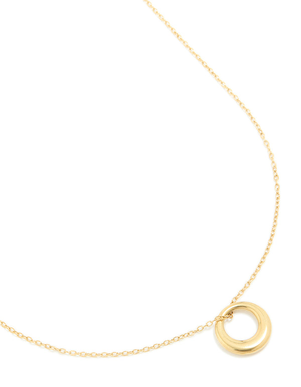 Featuring a waterproof disc pendant necklace in gold plated stainless steel close up view