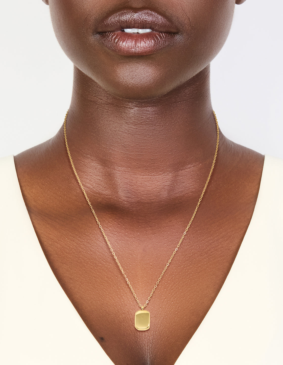 Waterproof gold plated stainless steel round rectangle engravable necklace with pendant on neck view