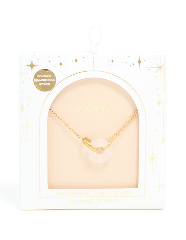 Featuring a waterproof acrylic pendant necklace in gold plated stainless steel with food-inspired doughnut design close up view
