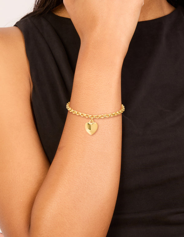 Showcasing a waterproof gold plated stainless steel chunky heart bracelet in gold on wrist view