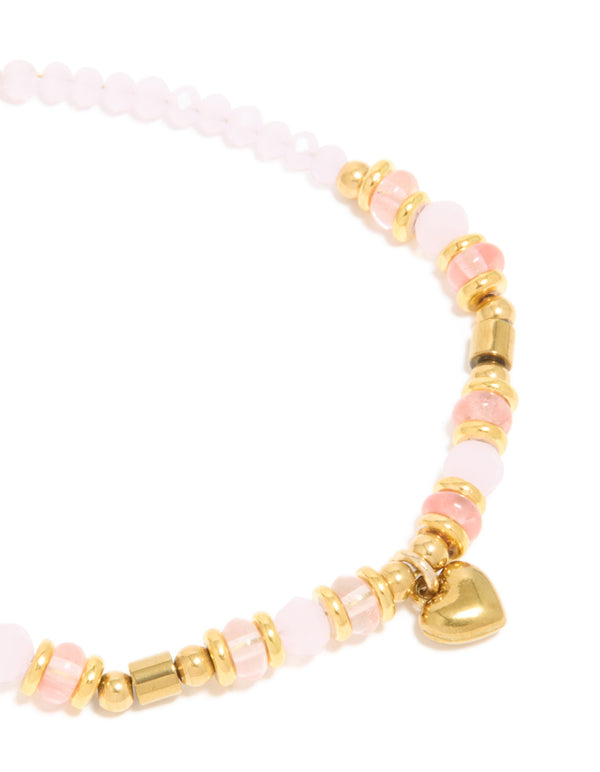 Explore waterproof gold plated stainless steel rose quartz semi precious mini heart bracelet crafted with beads, charm, and dainty details close up view