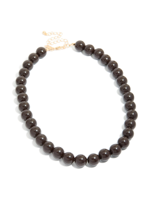 Designed with chocolate brown acrylic beaded and gold accents front view