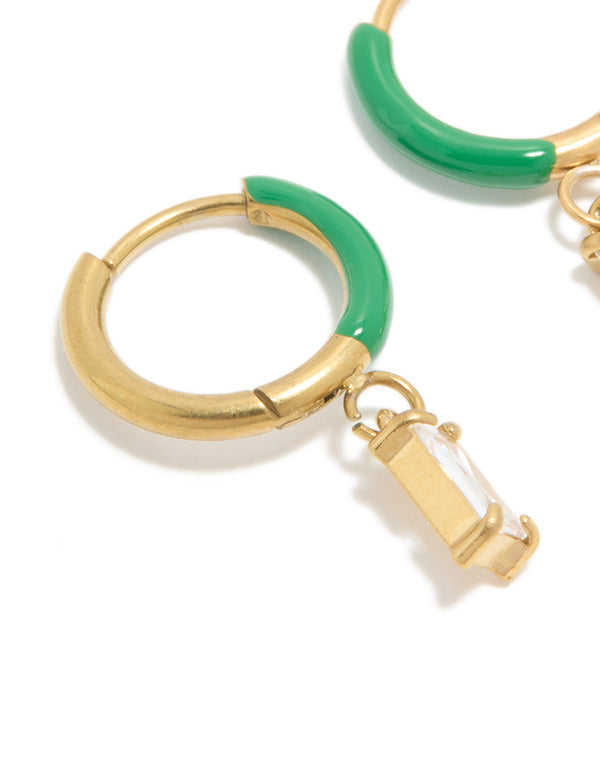 Crafted from waterproof gold plated stainless steel with emerald green enamel and cubic zirconia huggie earrings close up view