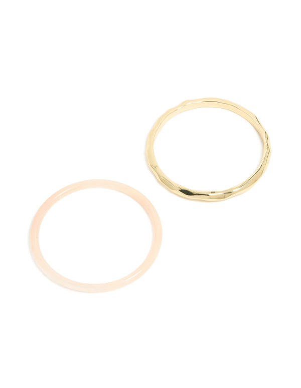 Discover a gold plated and pink acrylic bangle 2-pack designed with statement style front view