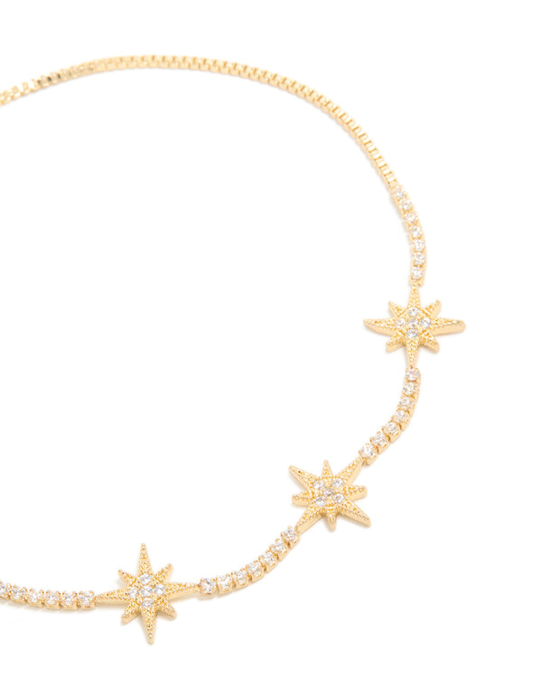 Beautiful gold plated cubic zirconia stars toggle bracelet with celestial design close up view
