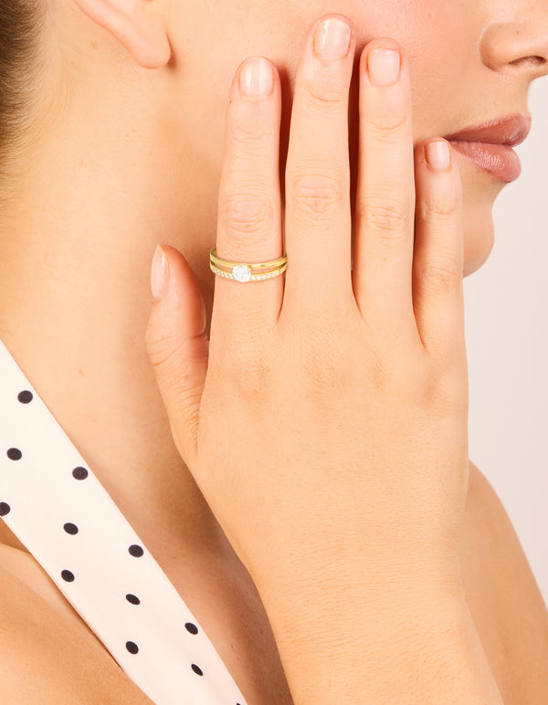 Featuring a waterproof gold plated stainless steel dainty double layered ring with cubic zirconia on finger view