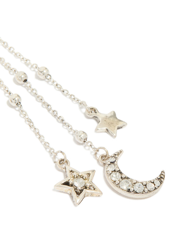 Crafted from antique silver diamante asymmetrical star and moon drop earrings with celestial charm statement design post detail view