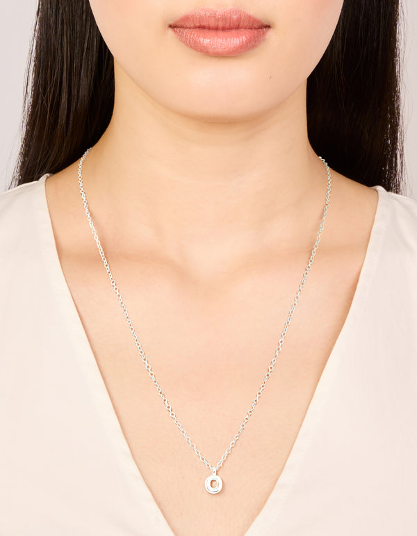 Elegant waterproof stainless steel mini bubble letter O necklace featuring initial pendant in dainty silver on neck view